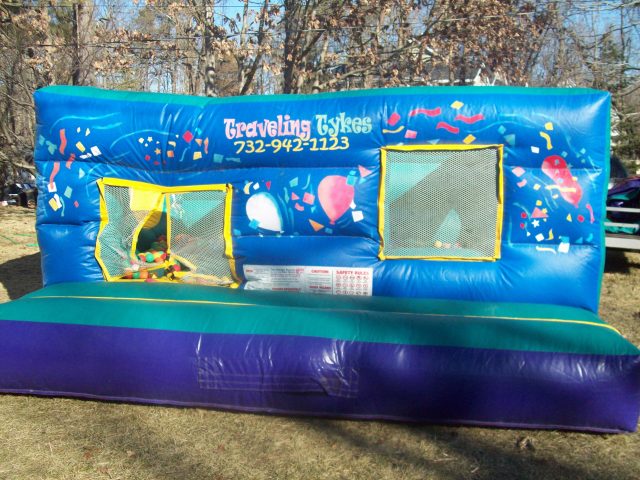 Blown up inflatable moonwalk ball pit rental