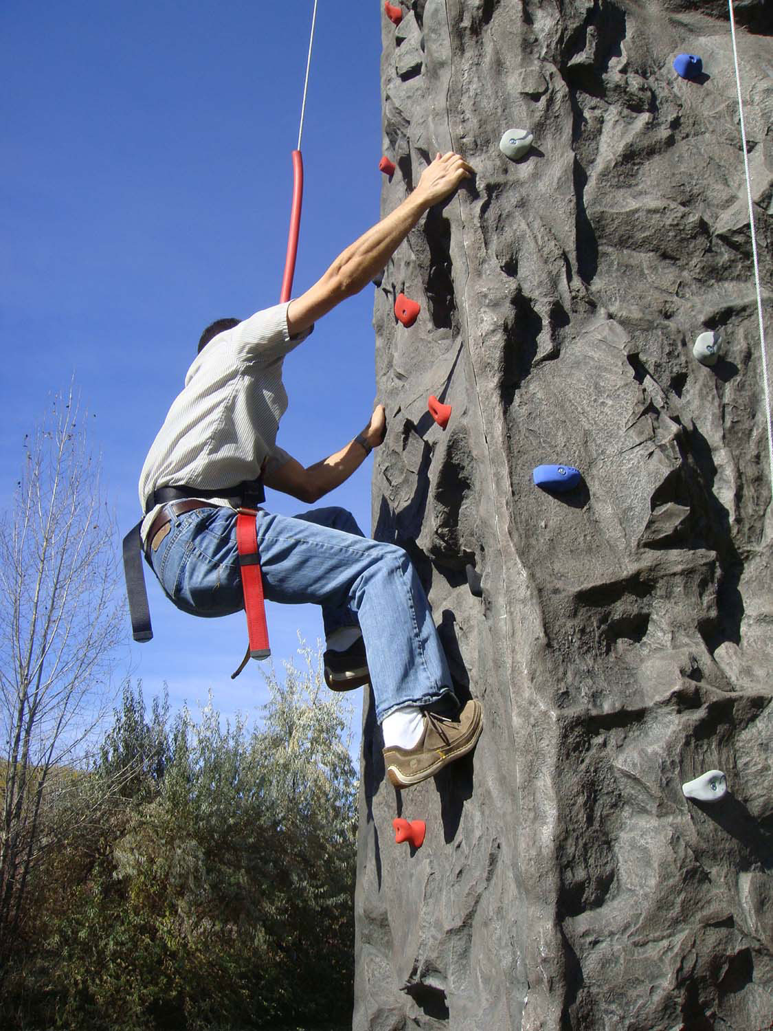 Climber climbing rockwall