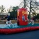 People Playing on Inflatable Bungee Tug of War